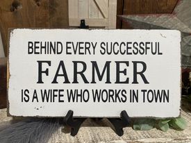 BEHIND EVERY SUCCESSFUL FARMER IS A WIFE WHO WORKS IN TOWN